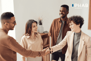 PHAB Service and Resource Sharing photo of a man and a woman shaking hands.