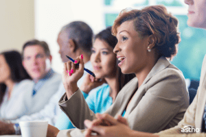 Bolstering Public Health Workforce Recruitment and Resilience - Graphic of a professional diverse team at a conference table in discussion.