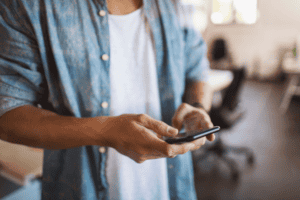 Person scrolling on phone.
