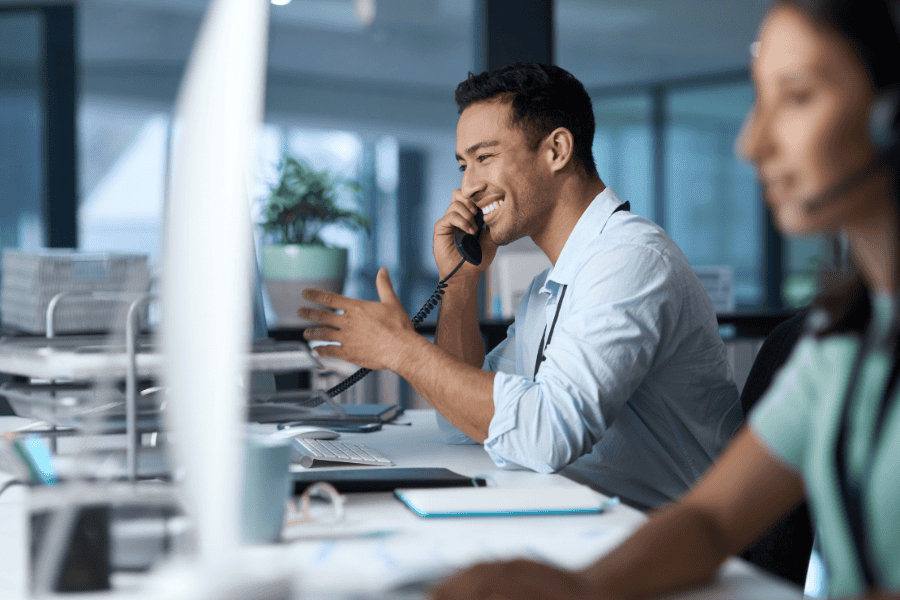 smiling office worker talking on phone