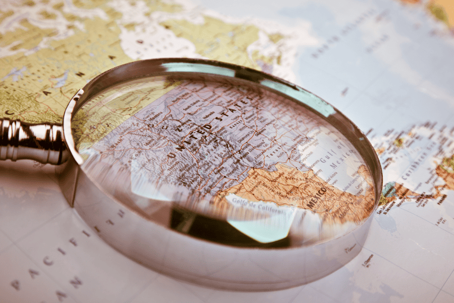 Magnifying glass on a map of the United States.