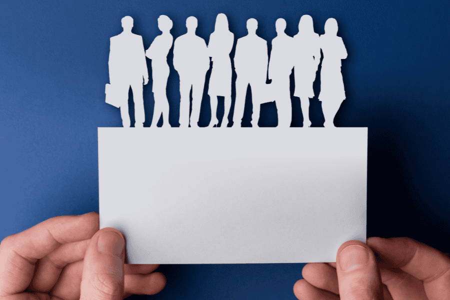 Paper cut out of office workers.