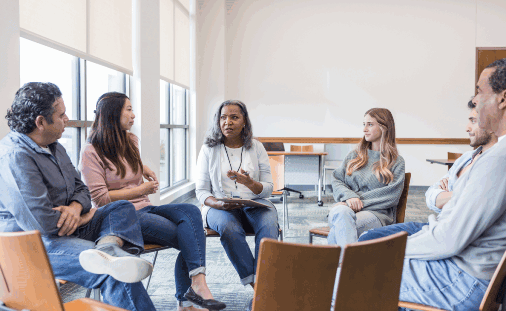 Woman leads a focus group discussion.