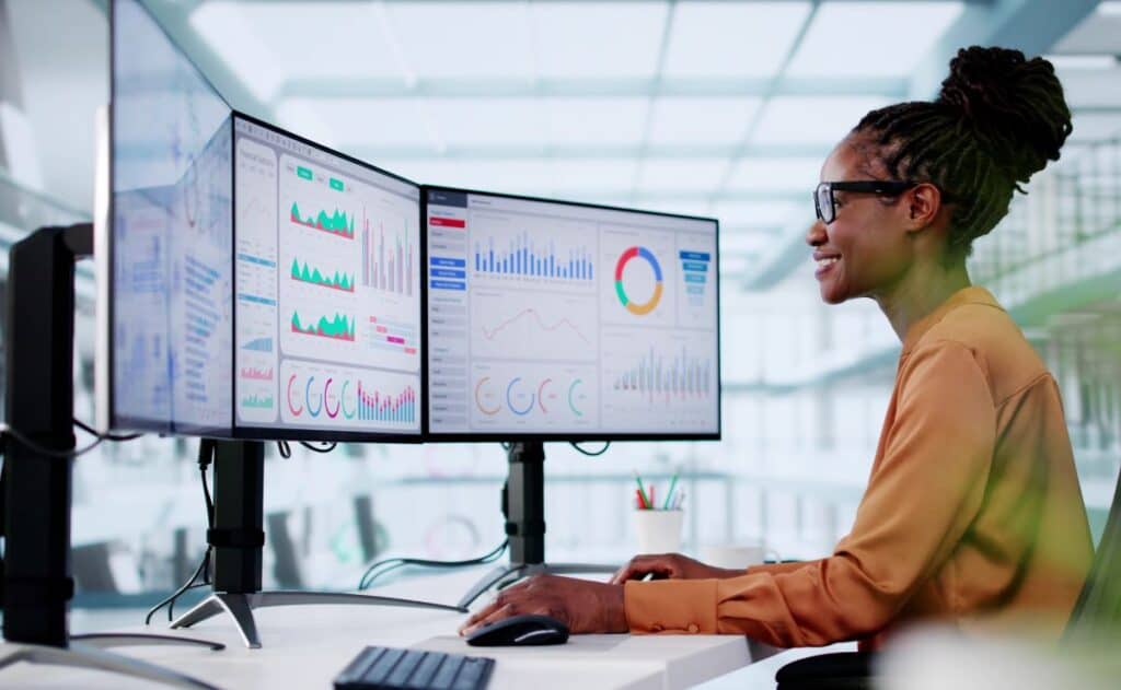 Woman working at her computer looking at analytics.