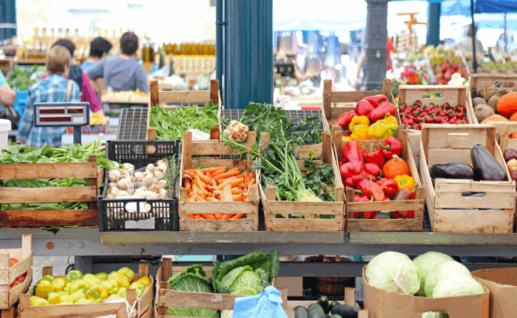 Stall at a farmer's market with fresh vegetables.