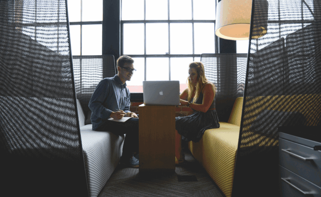 Coworkers Looking at Laptop