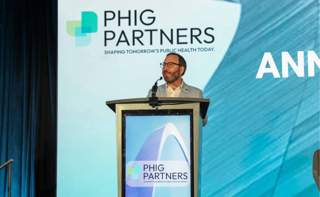 Dr. Joe Kanter delivers opening remarks during an event.