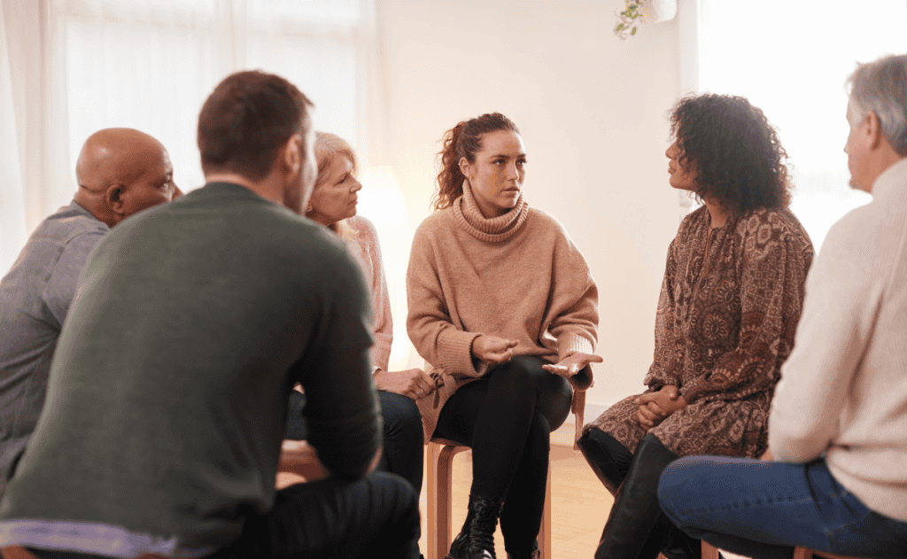 Woman speaking at a support group meeting