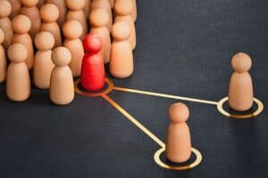 3d illustration of pawns with one pawn placed by another one. Concept of succession planning and leader or senior manager replacement.