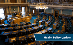 Banner reading "Health Policy Update" overlaying an image of a legislative chamber.