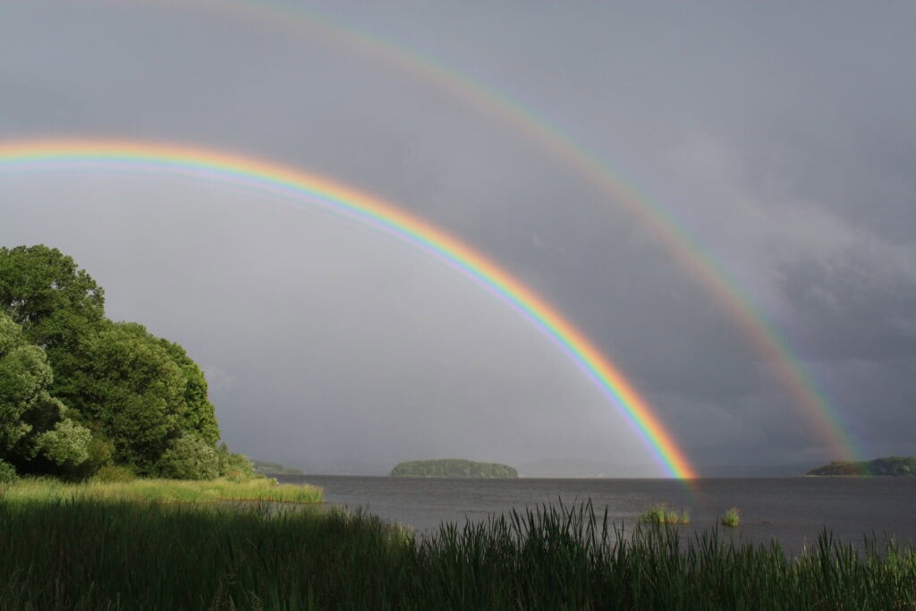 Double rainbow near a coastline