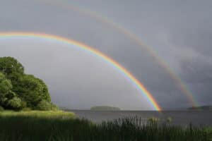 Double rainbow near a coastline